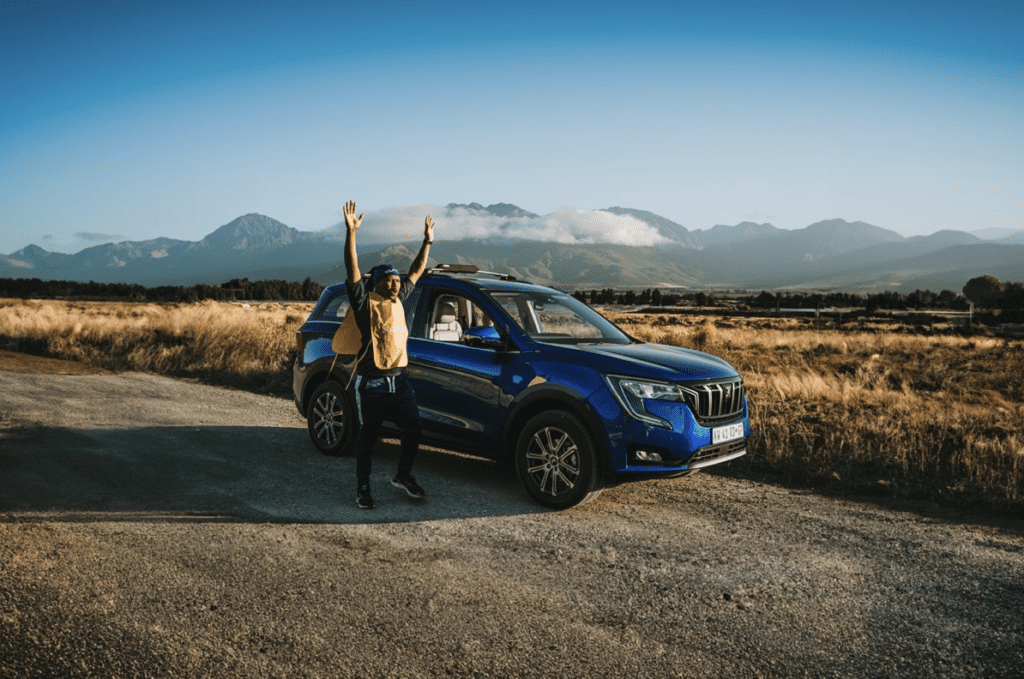 Man next to the Mahindra XUV700 ready to embark on adrenaline rushing activities